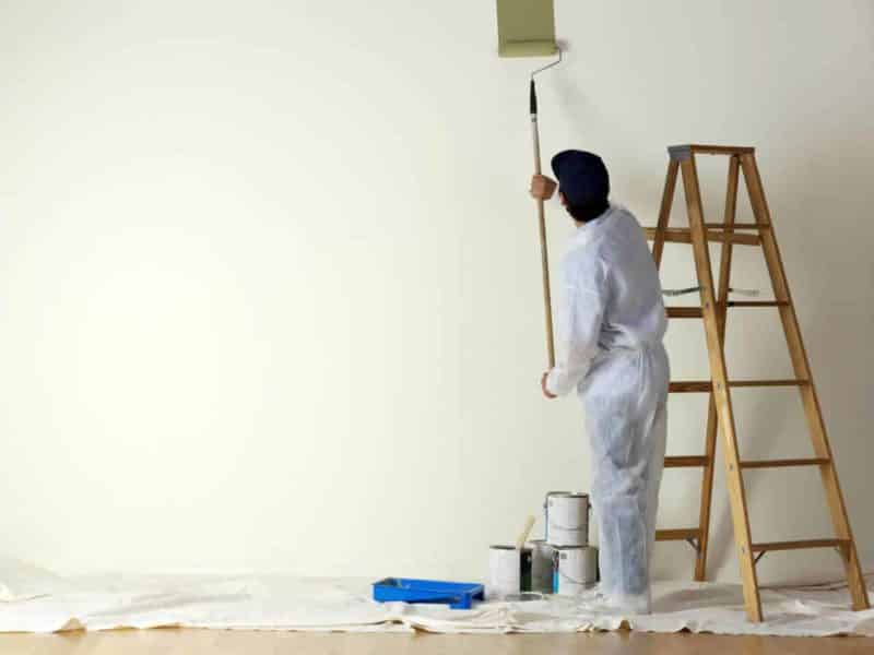painting-contractor-painting-with-a-roller.jpg